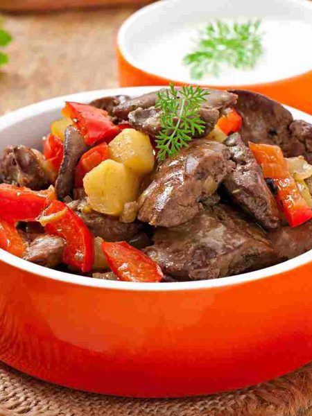 Marara stew from offal served in a bowl with vegetables.