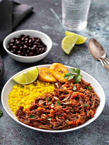 ropa-vieja-flank-steak-dish-with-rice-plantian-recipe-buster (1)