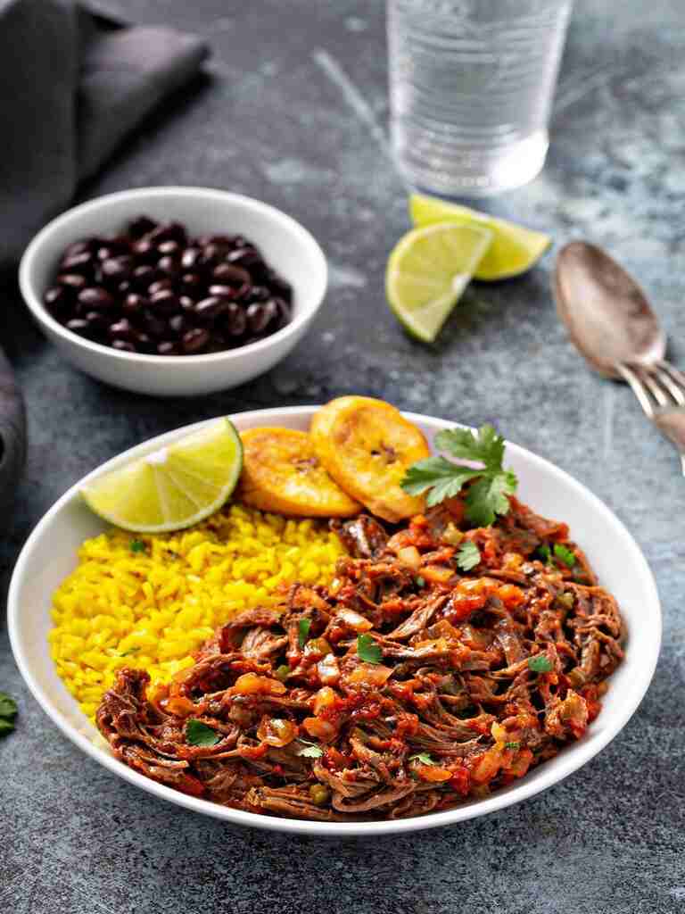 ropa-vieja-flank-steak-dish-with-rice-plantian-recipe-buster (1)